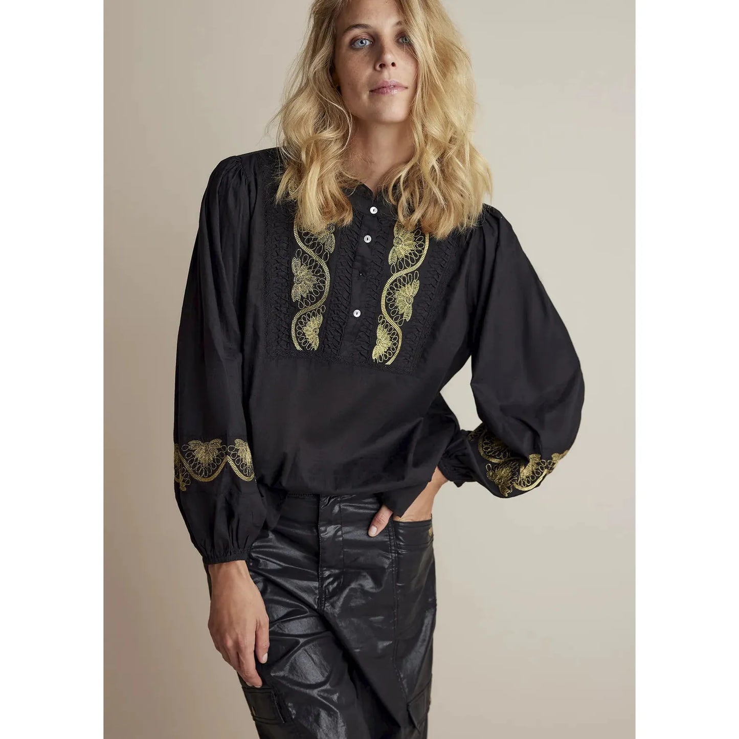 Black cotton blouse with gold thread detailing on the chest and around the sleeve