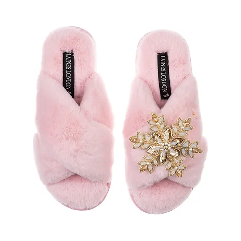 pink faux fur slippers with front cross design with removable snowflake brooch on one slipper